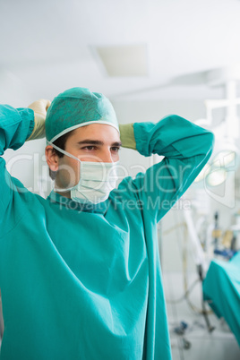 Close up of a surgeon attaching his mask