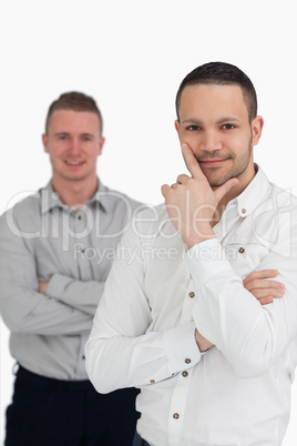 Two men crossing their arms
