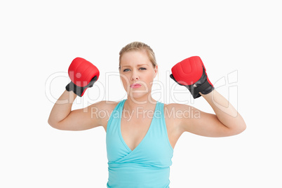 Woman rising her gloves