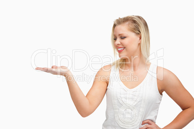 Smiling woman placing her hand palm up
