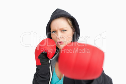 Woman with gloves hitting