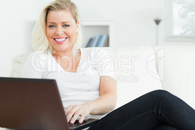 Casual woman sitting on a sofa
