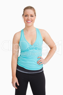 Woman with a hand on her hip wearing a sportswear