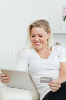 Casual woman using a tablet pc for e-commerce