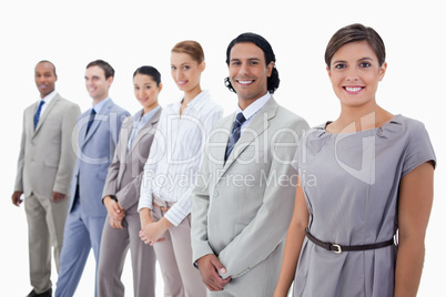 Close-up of colleagues smiling and looking straight