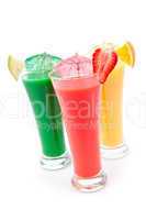 Full glasses of fruit juice with fruit pieces