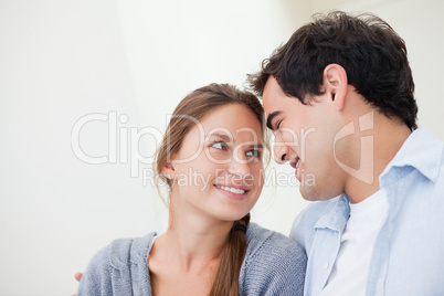 Couple smiling while embracing each other