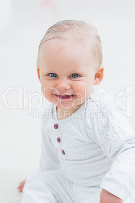 Baby looking at camera while smiling