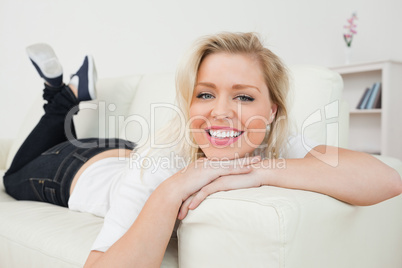 Woman smiling while lying down