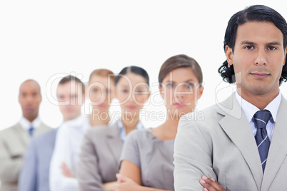 Big close-up of a serious business team in a single line looking