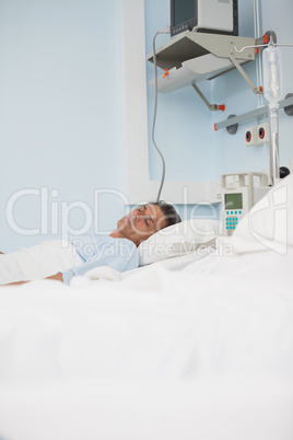 Patient sleeping while lying on a medical bed