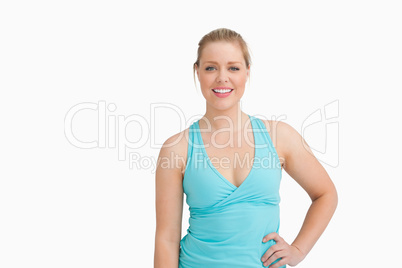 Woman with a blue t-shirt with a hand on her hip
