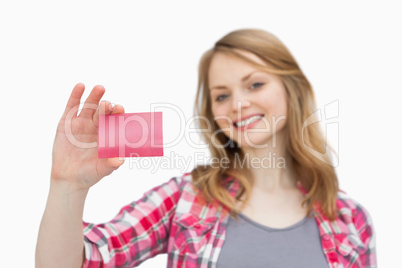 Smiling woman holding a loyalty card