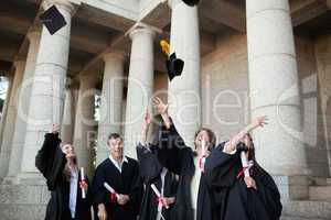 Graduates throwing their hats in the sky