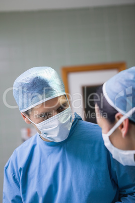 Doctor looking at a nurse
