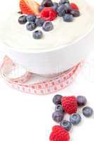Different berries cream with a tape measure