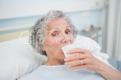 Elderly patient drinking