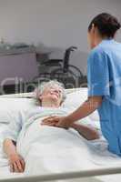 Nurse taking care of an elderly patient