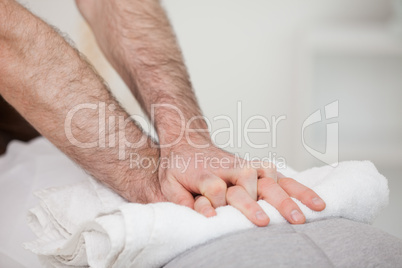 Close-up of a masseur massing a woman