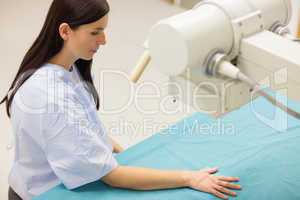 Patient placing her hand on a medical table