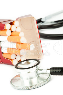 Cigarette pack next to a stethoscope