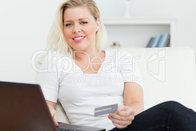 Woman with a credit card in her hand