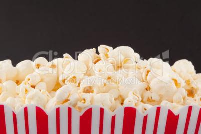 Close up of a top of a box full of pop corn