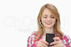 Smiling woman holding a mobile phone