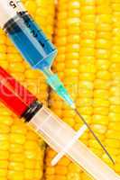 Two syringes on corn