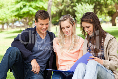 Three teenagers studying together