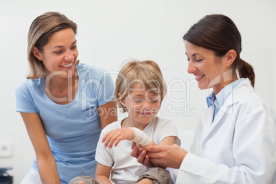 Child looking at his bandage