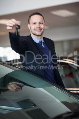 Dealer holding car keys