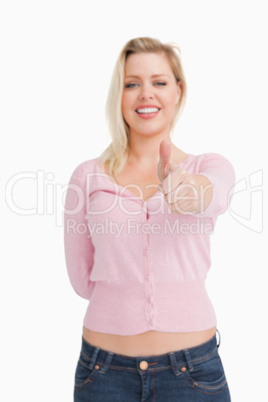 Joyful woman placing her thumbs up