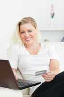 Casual woman using a laptop for e-commerce