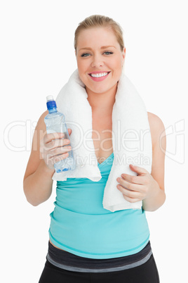 Woman holding a towel around her neck