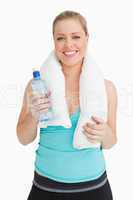 Woman holding a towel around her neck