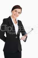 Businesswoman smiling with a clipboard