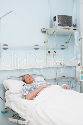 Female patient sleeping on a bed