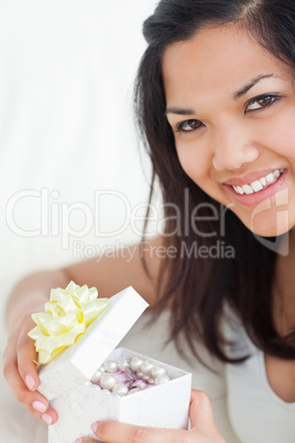 Close-up of a woman opening a gift box