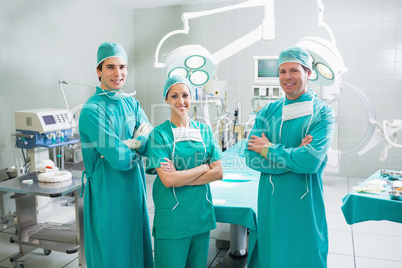 Surgeons with arms crossed smiling