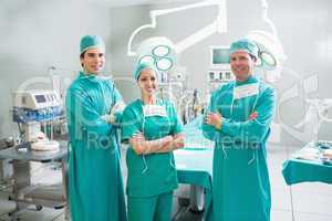 Surgeons with arms crossed smiling