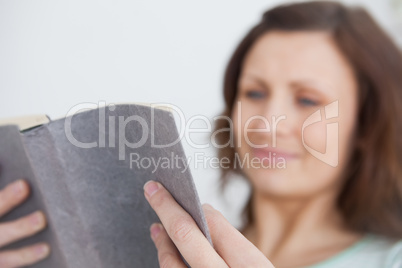 Focus on a woman holding a book