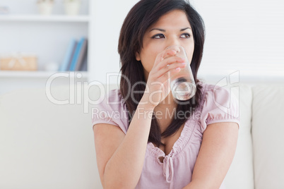 Woman drinking from a glass of water