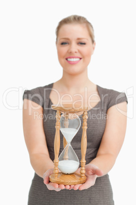 Woman smiling showing a hourglass