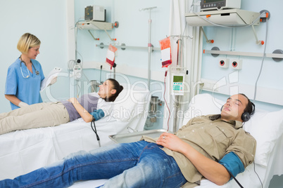 Patients lying on beds