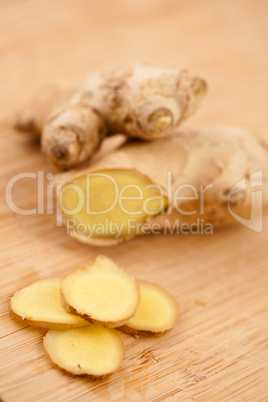 Slice of ginger and blurred piece of ginger