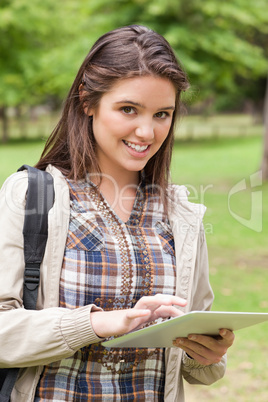 Portrait of a first-year student using a touch pad