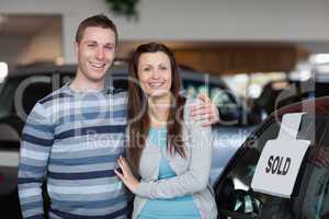 Couple purchasing a new car