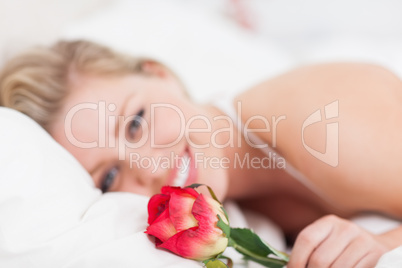 Young woman holding a rose Young woman holding a rose