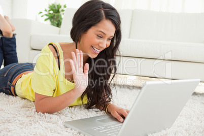 Beaming Latin woman on a video chat